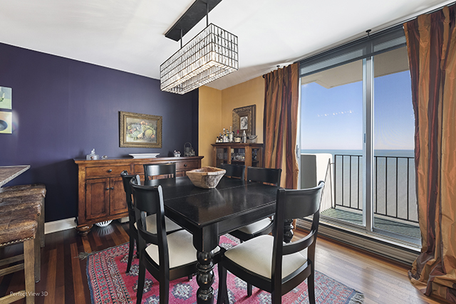 6033 North Sheridan Road, Unit 16A Chicago, IL 60660 - Photo 11 of 21 a view of a dining room with furniture window and wooden floor