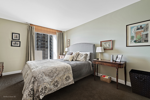 6033 North Sheridan Road, Unit 16A Chicago, IL 60660 - Photo 12 of 21 a bedroom with a bed and a window