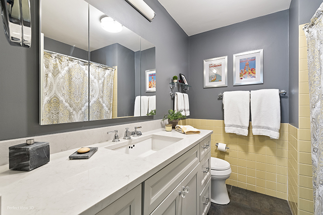 6033 North Sheridan Road, Unit 16A Chicago, IL 60660 - Photo 14 of 21 a bathroom with a sink and a mirror