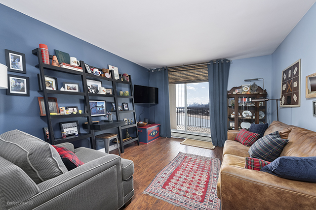 6033 North Sheridan Road, Unit 16A Chicago, IL 60660 - Photo 16 of 21 a living room with furniture workspace and a bookshelf