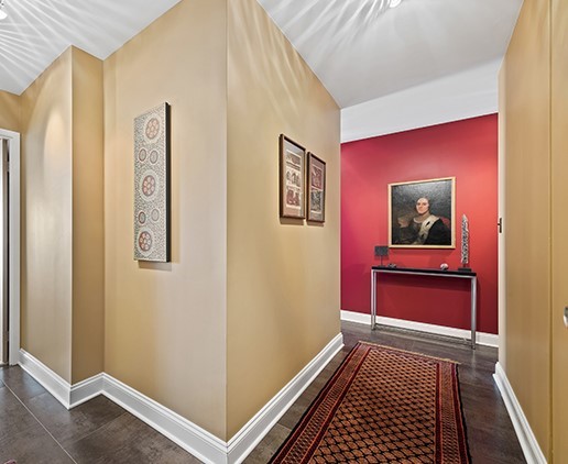 6033 North Sheridan Road, Unit 16A Chicago, IL 60660 - Photo 4 of 21 a view of a hallway with wooden floor
