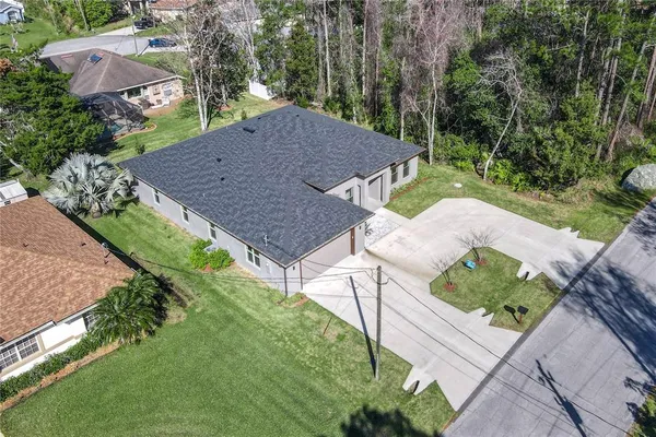 a view of a patio with table and chairs and potted plants