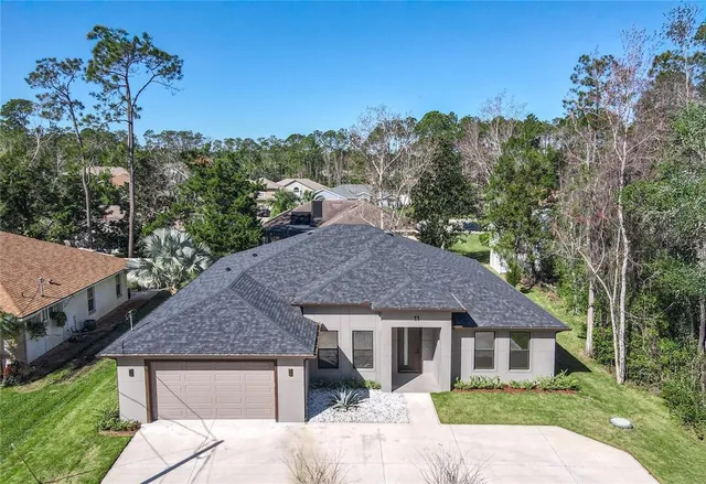 a aerial view of a house with a yard