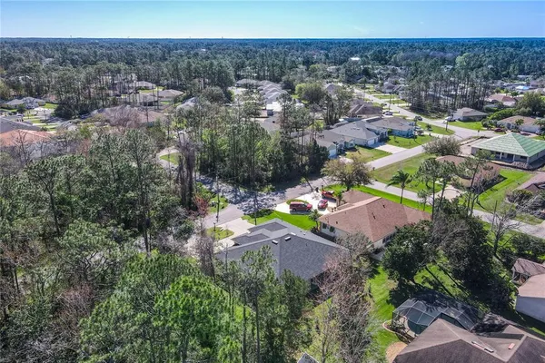 an aerial view of a house with a garden