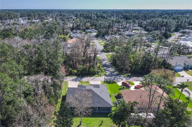 an aerial view of house with yard swimming pool and outdoor seating
