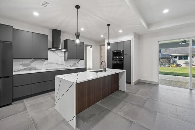 an empty room with a ceiling fan and carpet