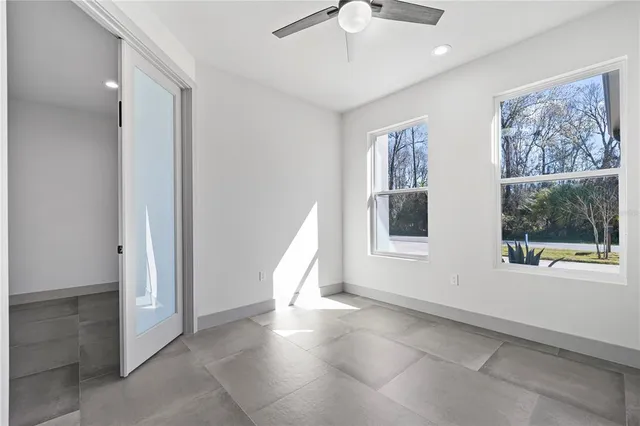a bathroom with a shower and a sink
