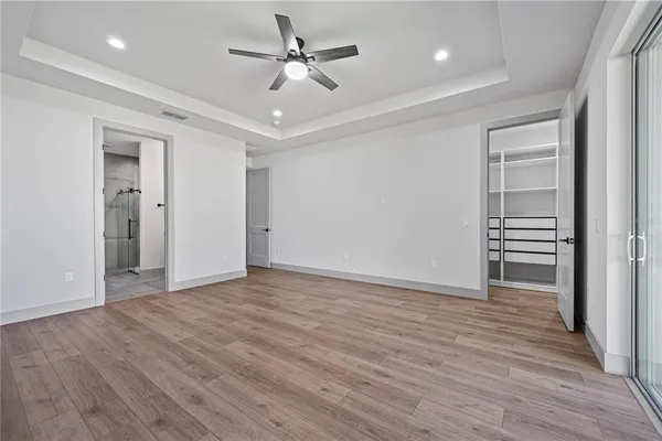a view of a hallway with stairs