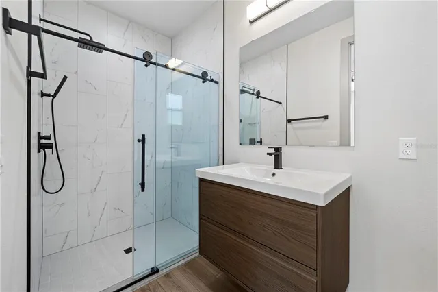 a bathroom with a toilet a sink and a shower