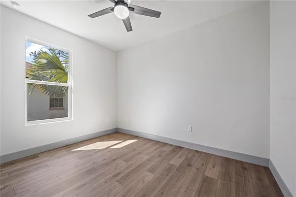 an empty room with wooden floor
