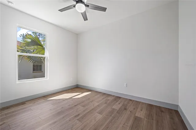 an empty room with wooden floor