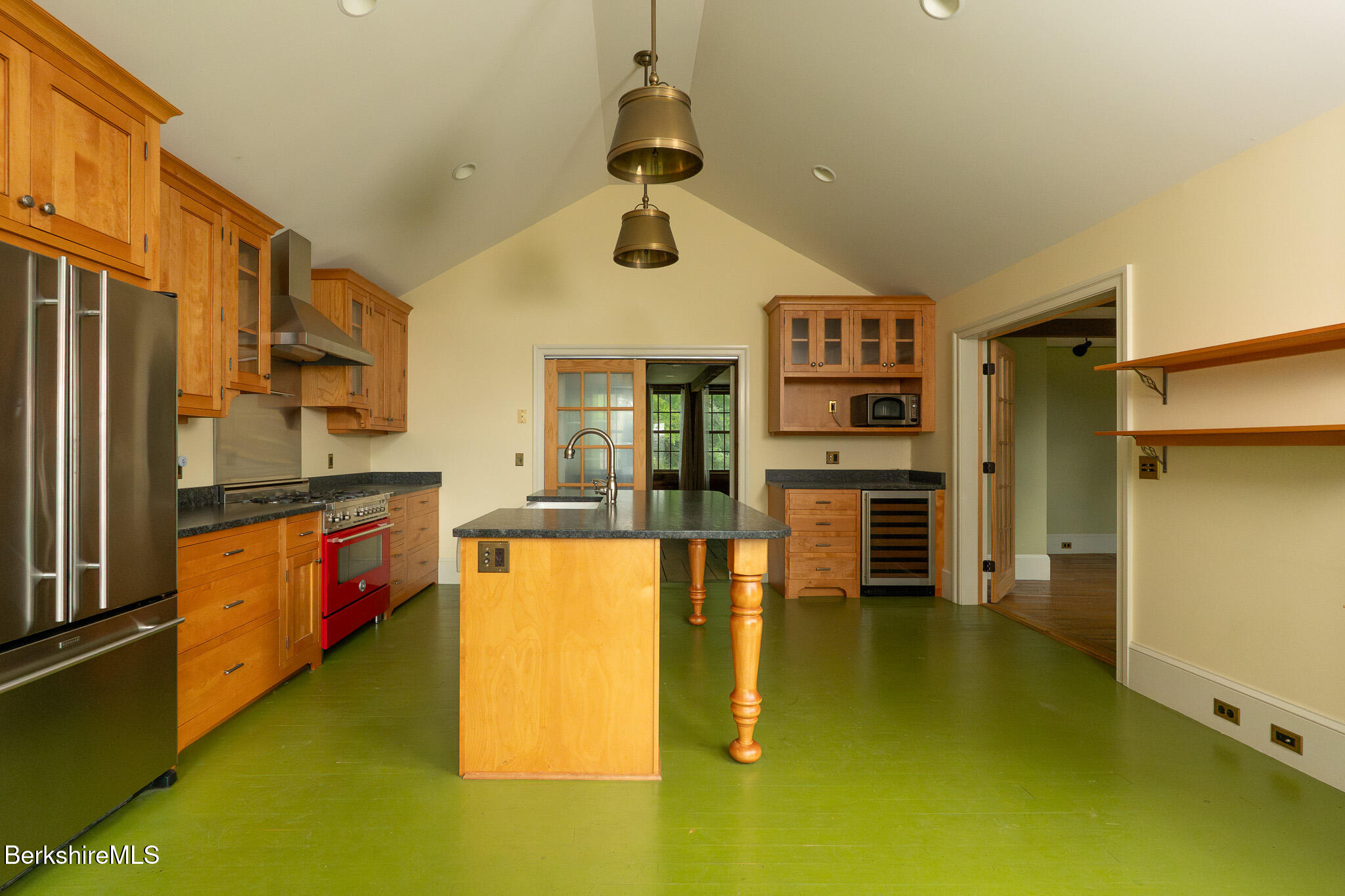 560 Stockbridge Road Lee, MA 01238 - Photo 12 of 48 a kitchen with stainless steel appliances granite countertop a refrigerator and a stove top oven