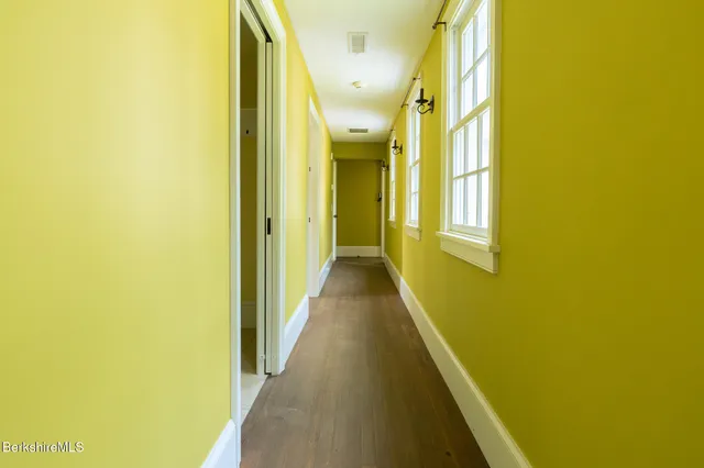 a view of a hallway with windows