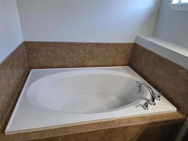 a bath tub sitting in a bathroom