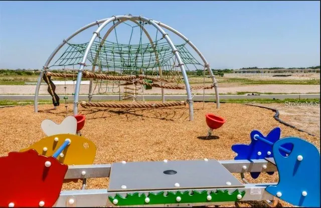a picture of a table and chairs with wooden floor
