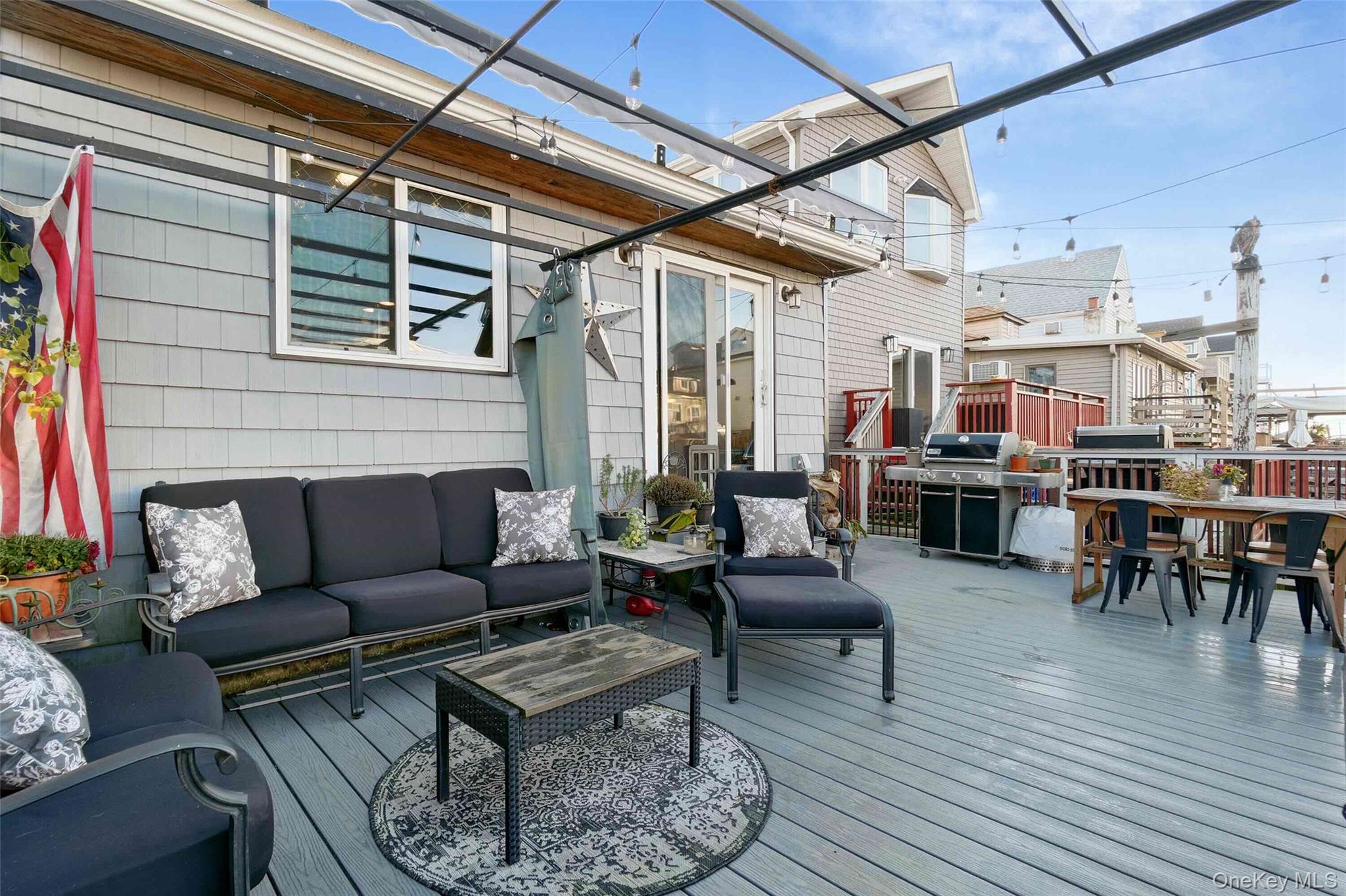 27 West 11th Road Queens, NY 11693 - Photo 18 of 18 Wooden deck featuring area for grilling, an outdoor living space, and outdoor dining area