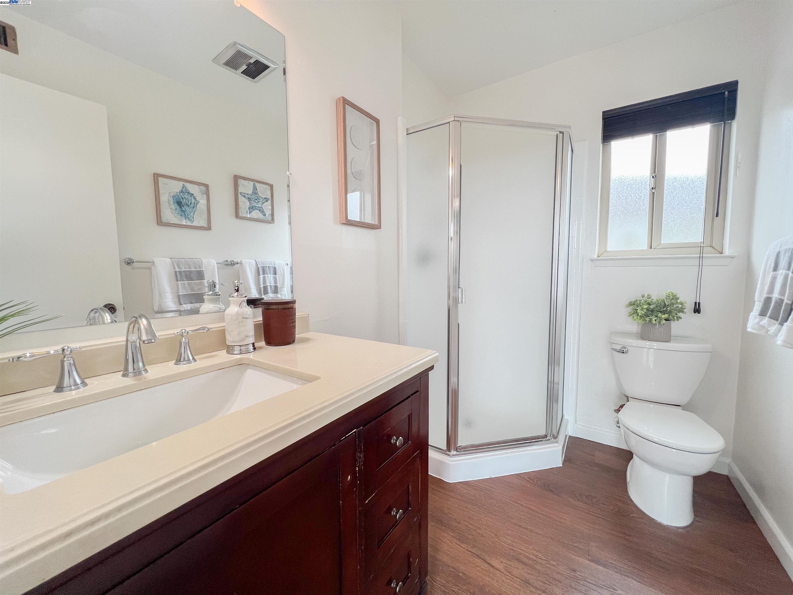 1444 Walnut Street Berkeley, CA 94709 - Photo 18 of 58 a view of bathroom with a sink toilet and a mirror