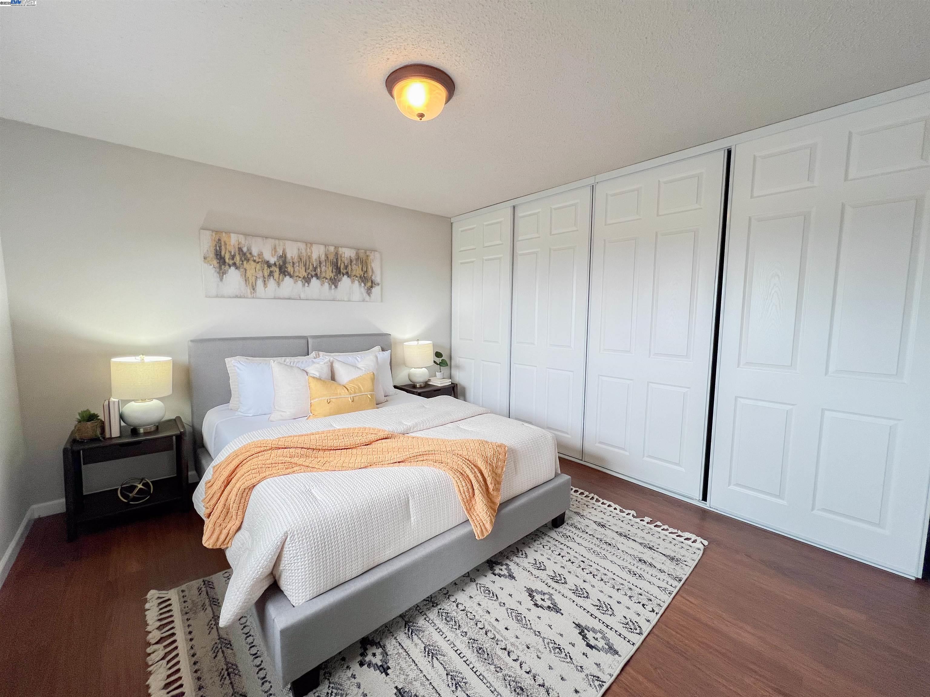 1444 Walnut Street Berkeley, CA 94709 - Photo 19 of 58 a bedroom with a bed and a lamp on dresser