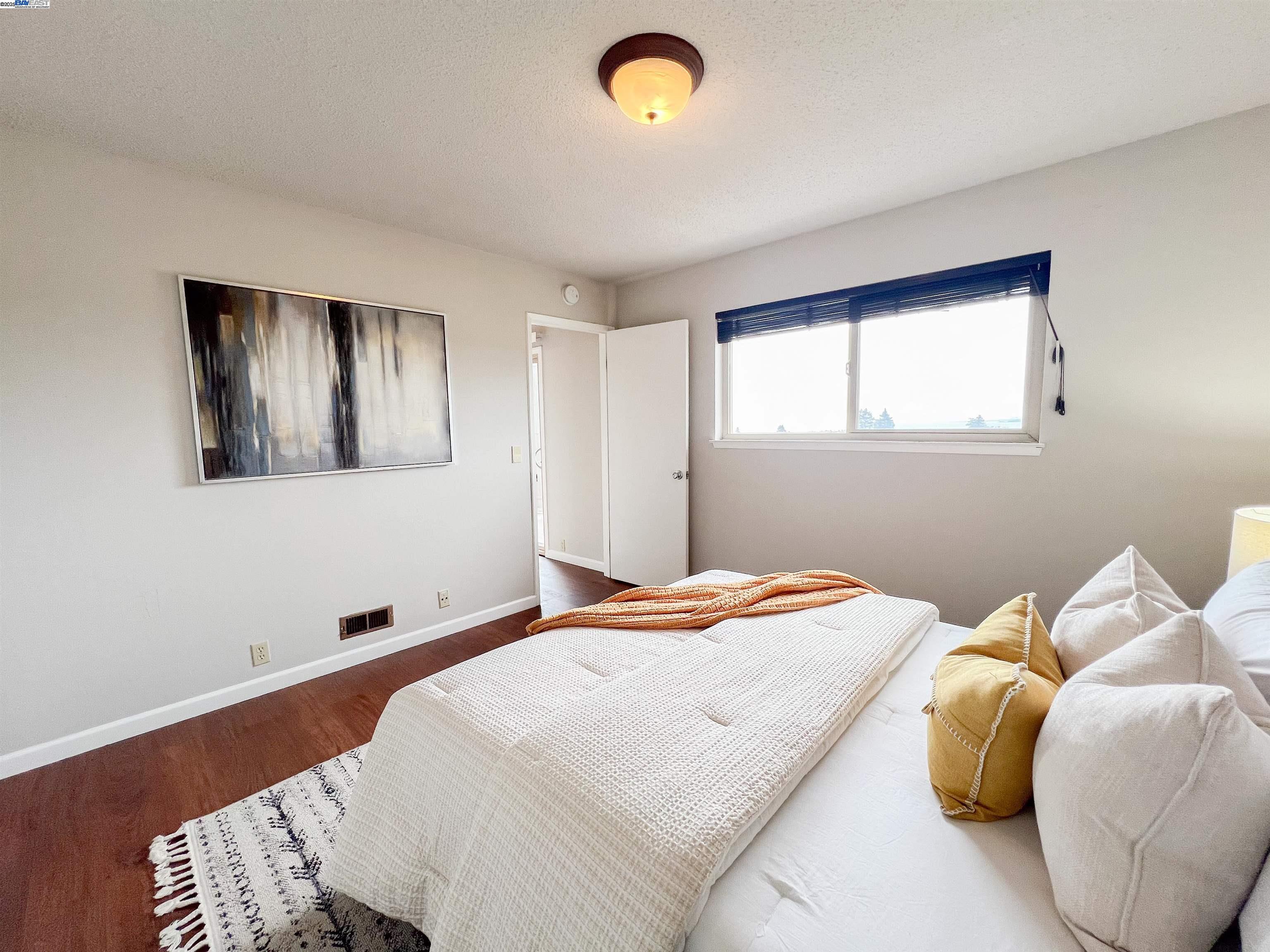 1444 Walnut Street Berkeley, CA 94709 - Photo 20 of 58 a bedroom with a bed and a window