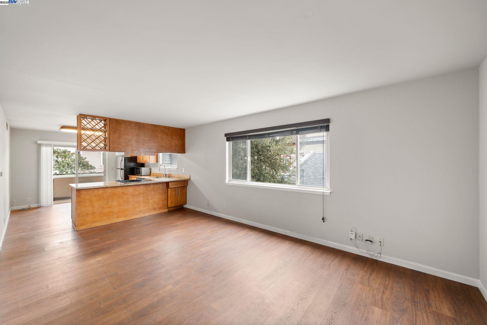 1444 Walnut Street Berkeley, CA 94709 - Photo 25 of 58 a view of kitchen with wooden floor and window