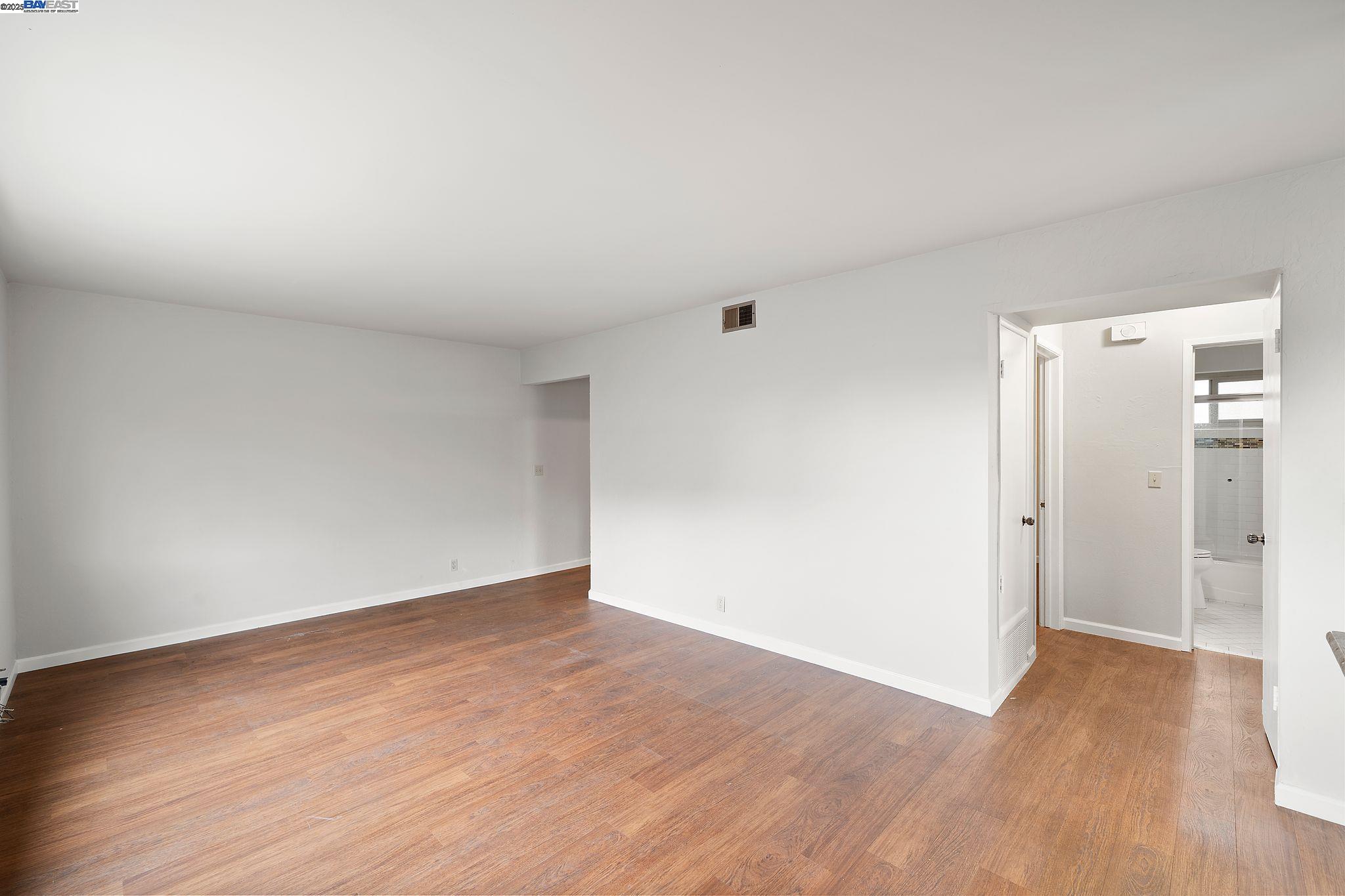 1444 Walnut Street Berkeley, CA 94709 - Photo 27 of 58 a view of an empty room with wooden floor and closet