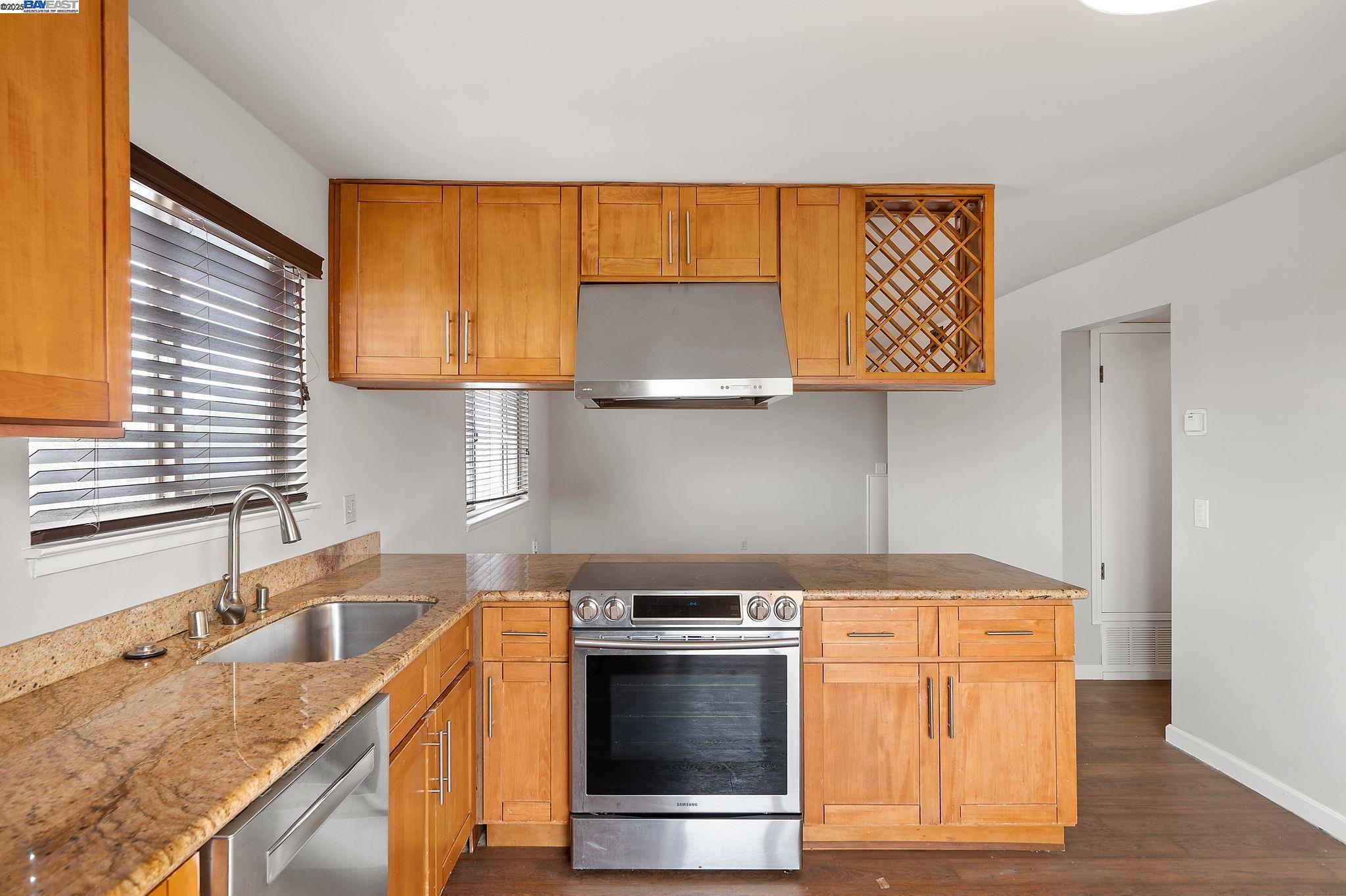 1444 Walnut Street Berkeley, CA 94709 - Photo 35 of 58 a kitchen with a sink stove and cabinets