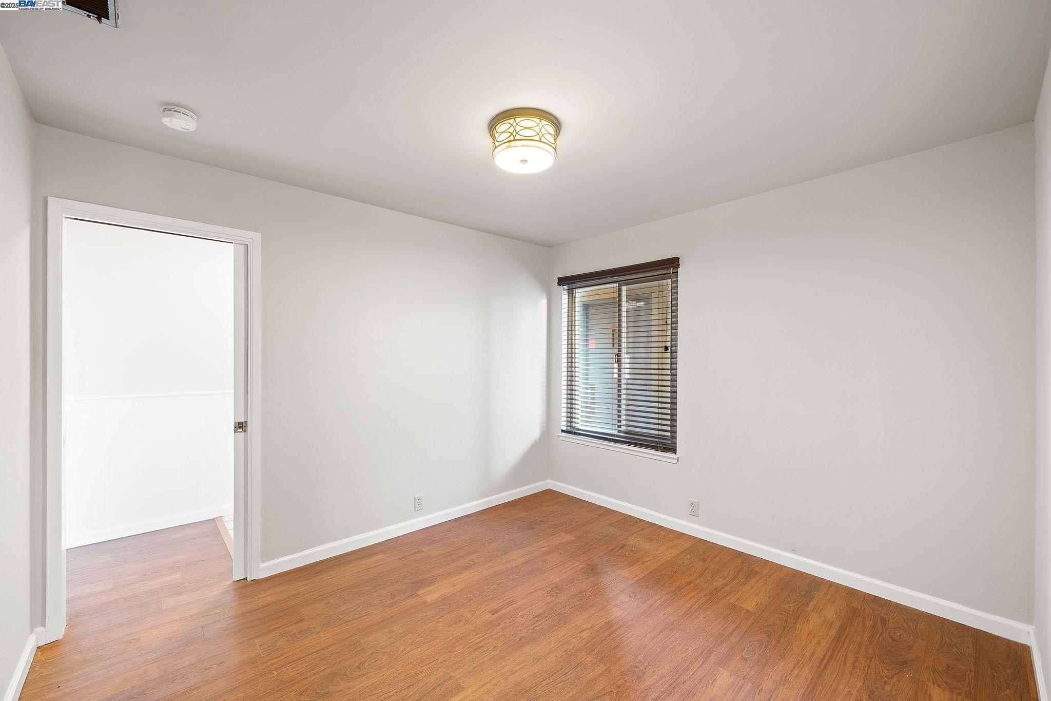 1444 Walnut Street Berkeley, CA 94709 - Photo 39 of 58 a view of an empty room with a window