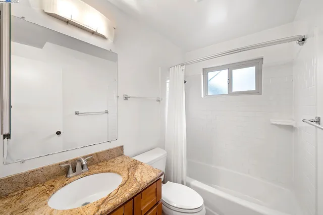 a picture of a bench in front of a window