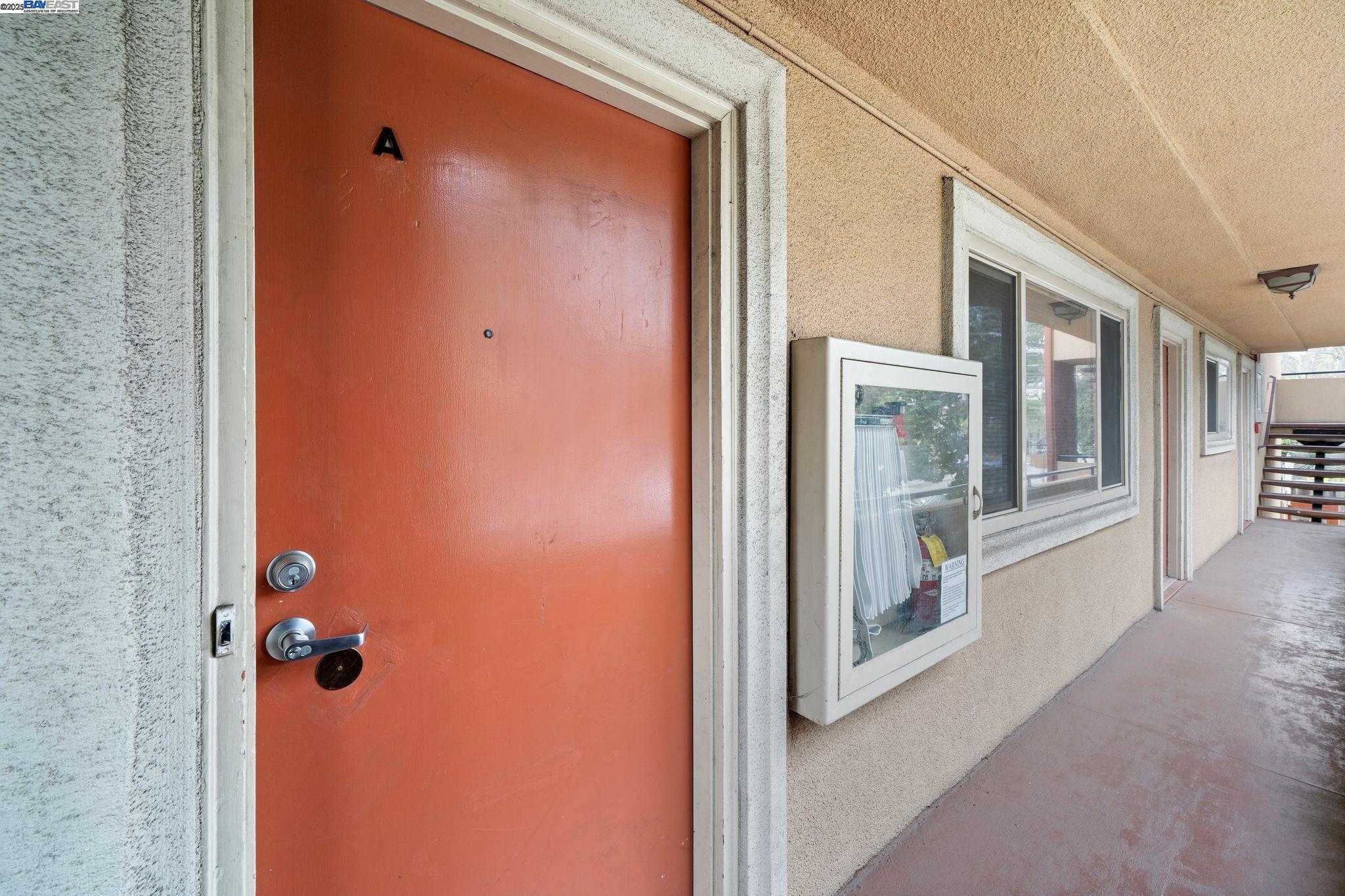 1444 Walnut Street Berkeley, CA 94709 - Photo 41 of 58 a view of a hallway with wooden floor