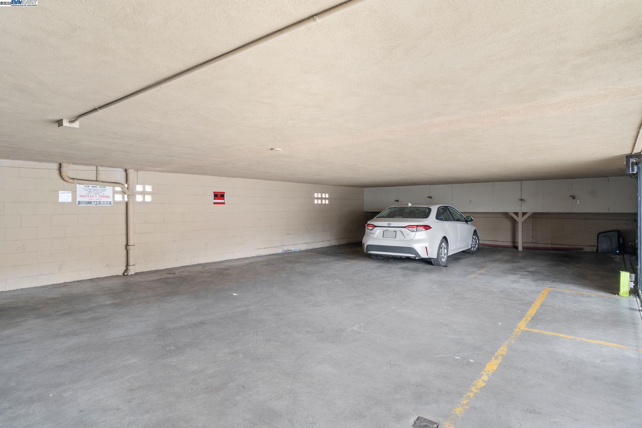 1444 Walnut Street Berkeley, CA 94709 - Photo 42 of 58 a car parked in parking area next to a building