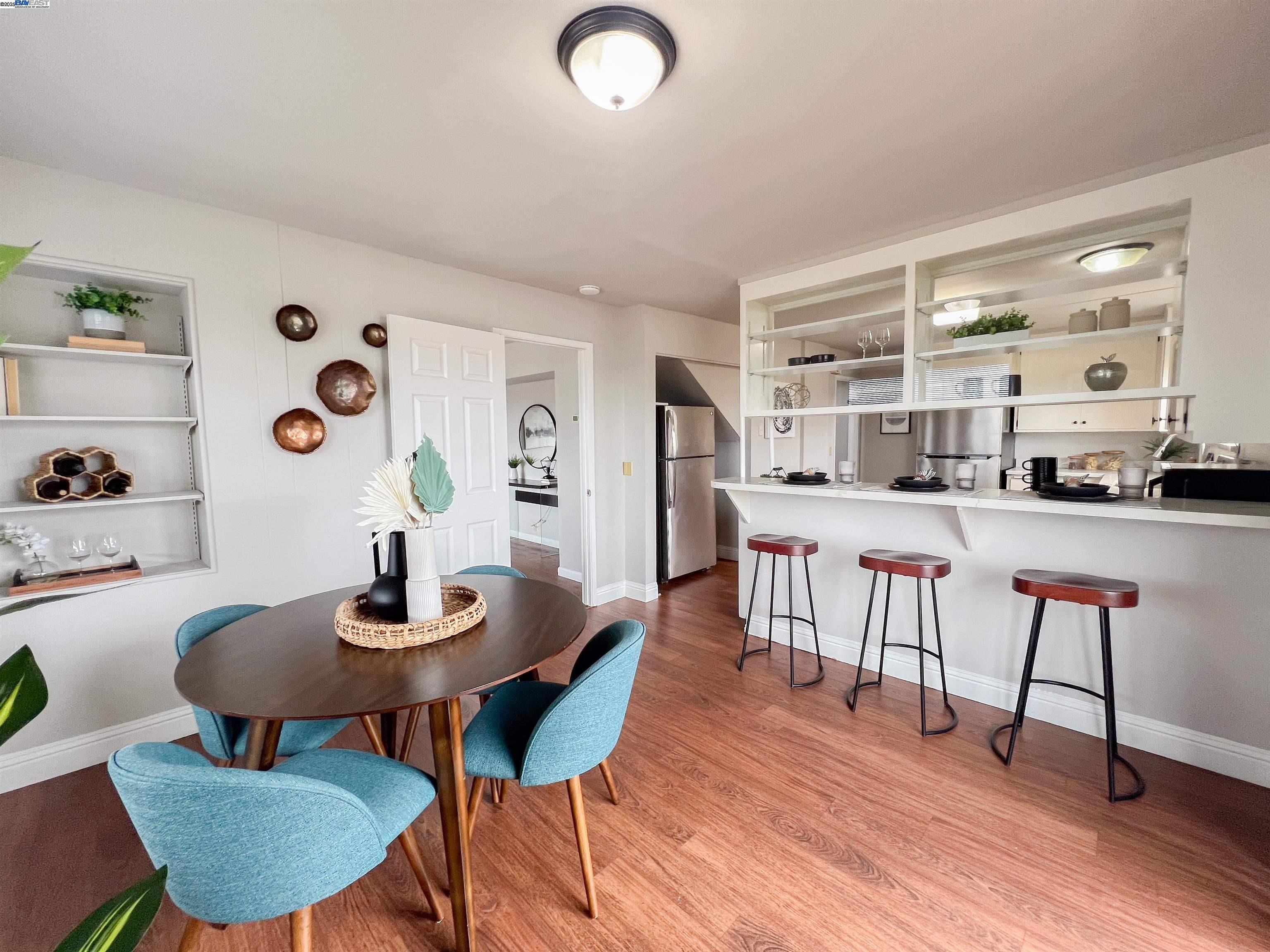 1444 Walnut Street Berkeley, CA 94709 - Photo 8 of 58 a view of a dining room with furniture and wooden floor