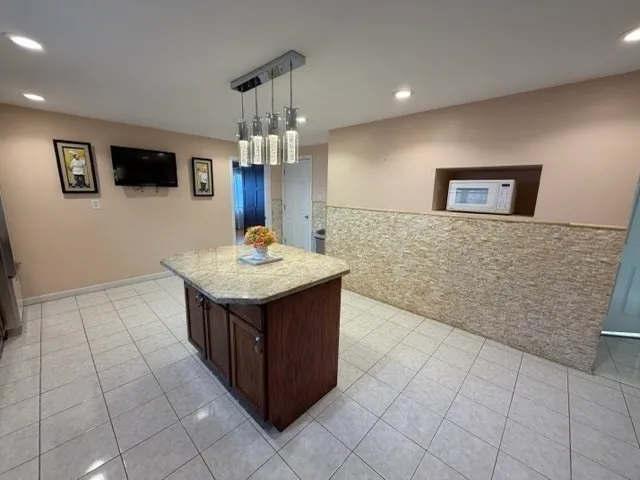 a kitchen with stainless steel appliances a sink stove and cabinets