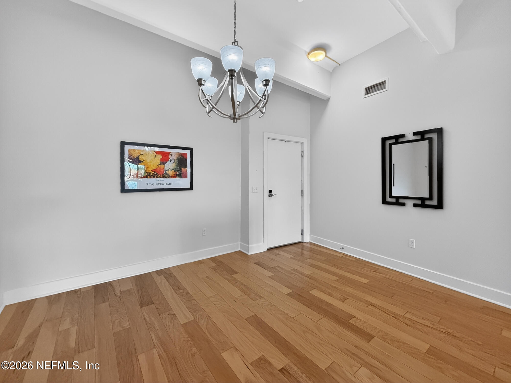 1661 Riverside Avenue, Unit 407 Jacksonville, FL 32204 - Photo 6 of 60 a view of empty room with wooden floor and ceiling fan