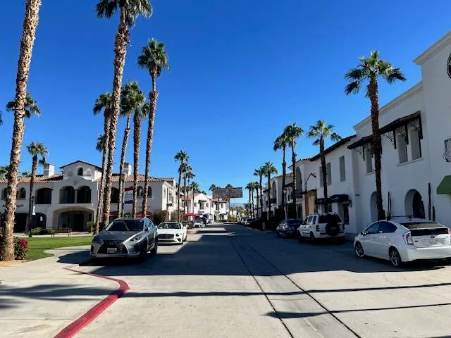a view of a building with a fountain in front of it