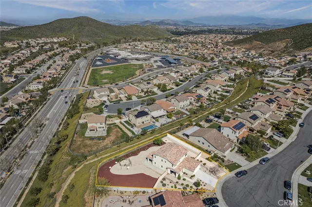 an aerial view of residential houses with outdoor space