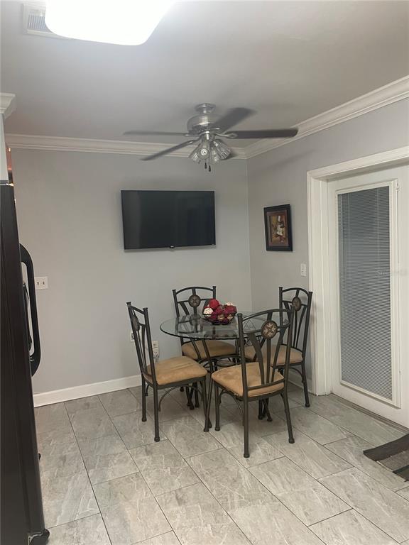 575 Tiberon Cove Road Longwood, FL 32750 - Photo 16 of 56 a view of a dining room with furniture