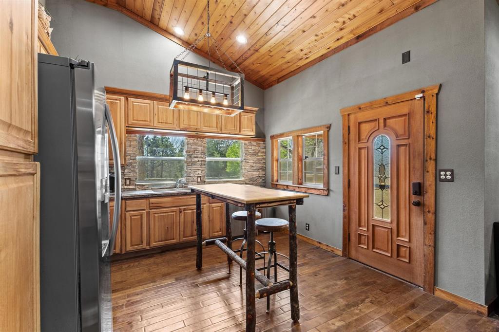 236 Homesite Road Pottsboro, TX 75076 - Photo 22 of 40 a view of a livingroom with furniture window and wooden floor