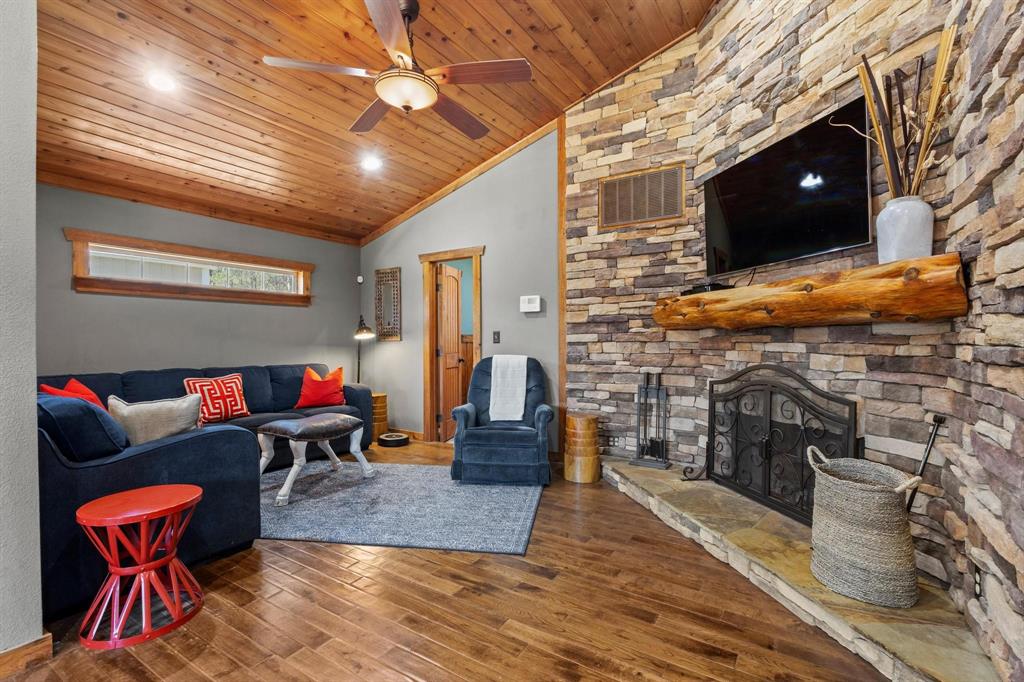 236 Homesite Road Pottsboro, TX 75076 - Photo 25 of 40 a living room with furniture and a flat screen tv