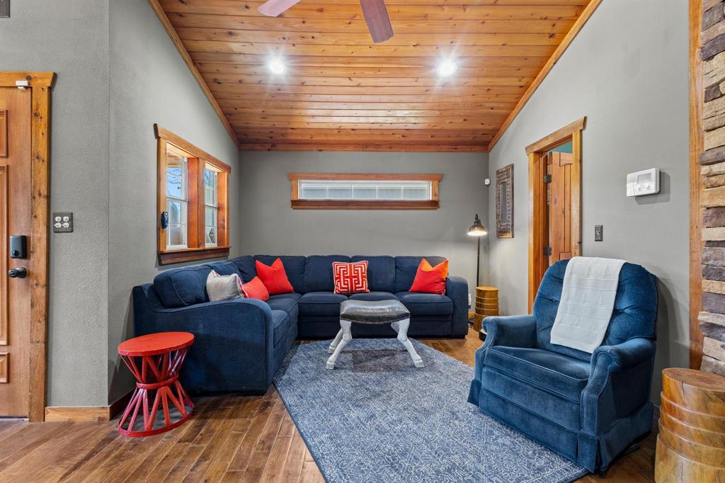 236 Homesite Road Pottsboro, TX 75076 - Photo 26 of 40 a living room with furniture and a wooden floor