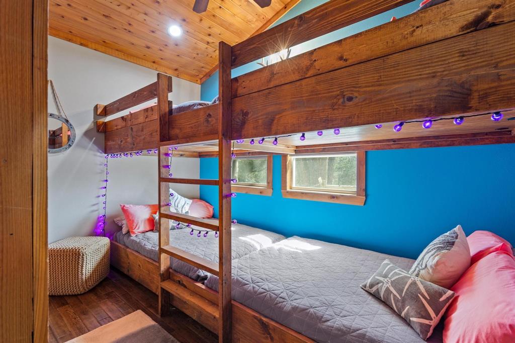 236 Homesite Road Pottsboro, TX 75076 - Photo 30 of 40 a bedroom with bed and a couch