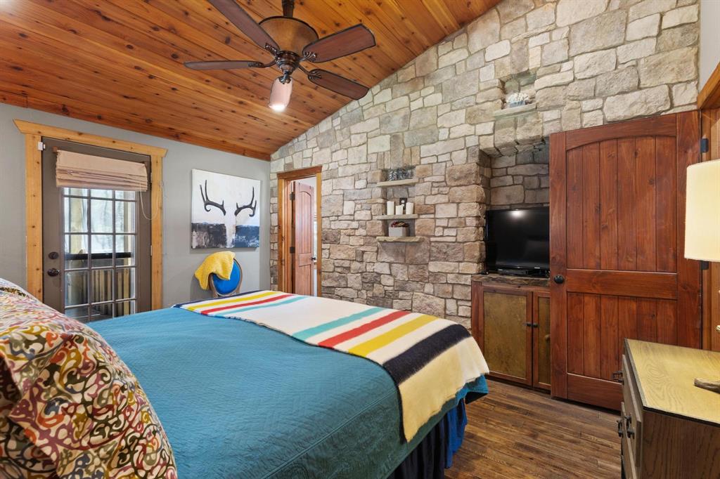 236 Homesite Road Pottsboro, TX 75076 - Photo 35 of 40 a bed room with a bed and a television