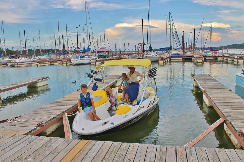 236 Homesite Road Pottsboro, TX 75076 - Photo 40 of 40 a view of a balcony with chairs and wooden floor