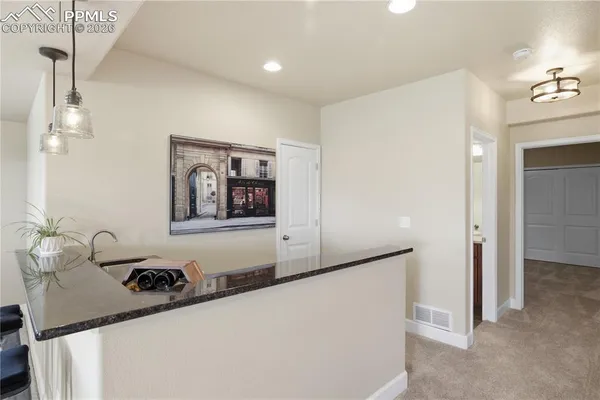 a kitchen with stainless steel appliances a sink a stove and a window