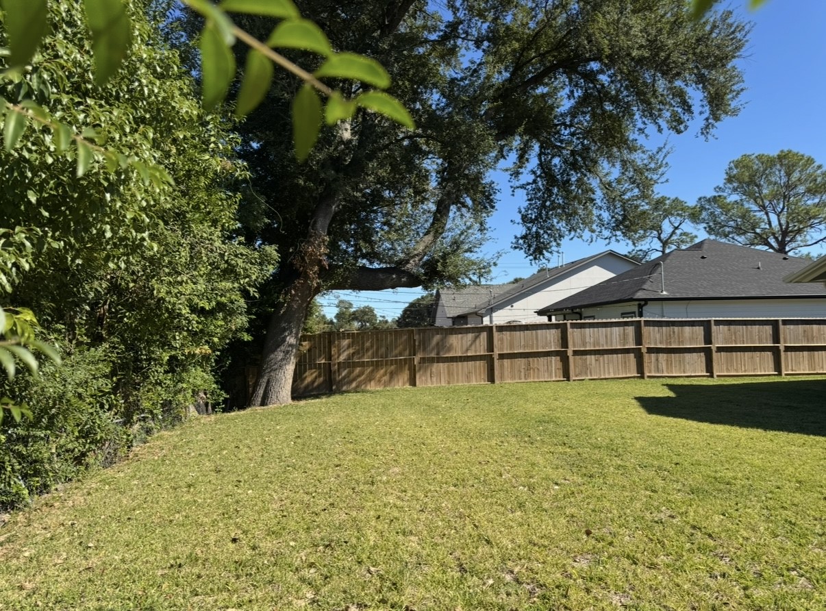 8437 Winthrop Lane Houston, TX 77075 - Photo 17 of 22 a view of a house with a yard