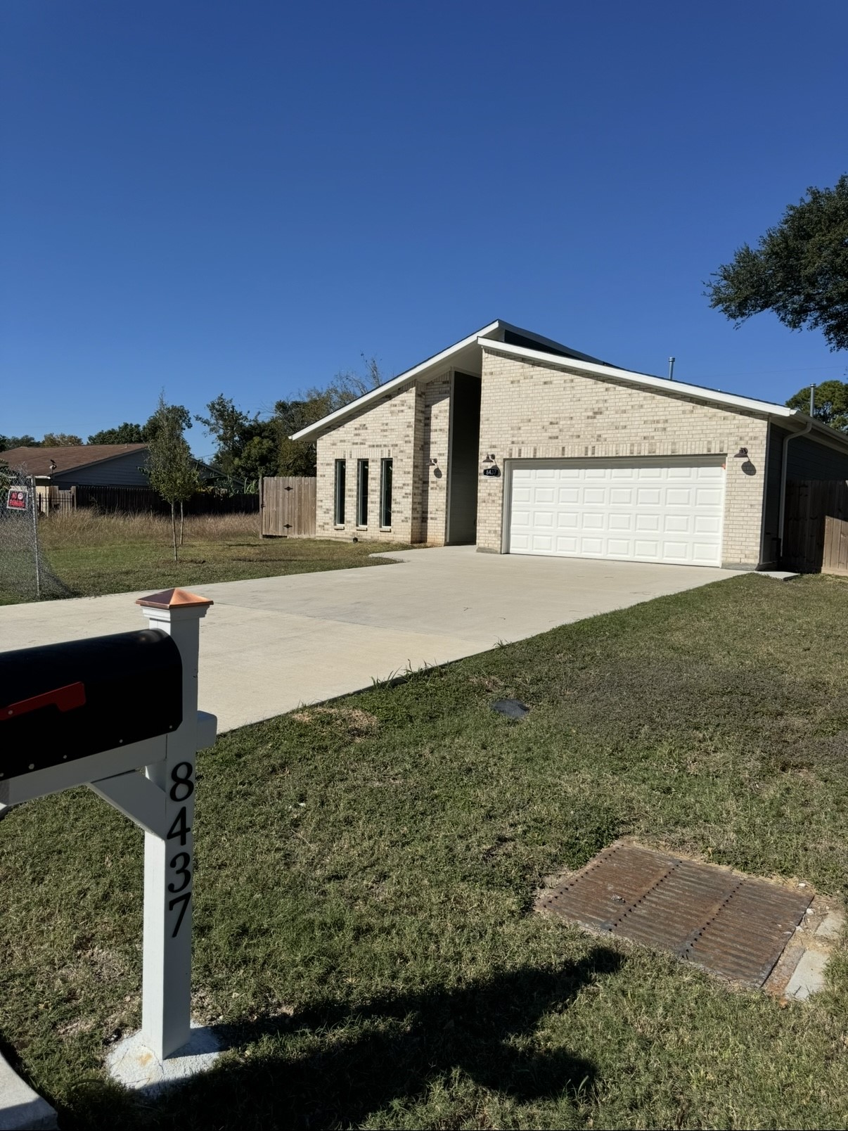 8437 Winthrop Lane Houston, TX 77075 - Photo 2 of 22 a front view of a house with a yard