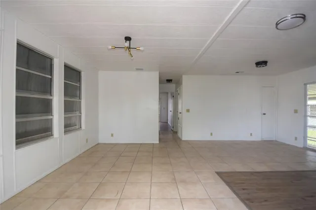 a bathroom with a granite countertop sink mirror and shower