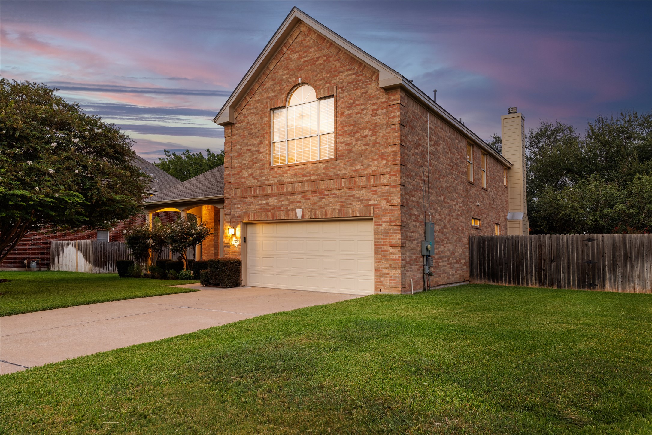205 Ridge Run Court Georgetown, TX 78628 - Photo 1 of 1 This classic brick exterior is warm and welcoming, highlighted by soft twilight lighting that enhances its curb appeal. The home sits on a quiet cul-de-sac with a landscaped front yard, mature trees, and a covered entry that sets the tone for what awaits inside.