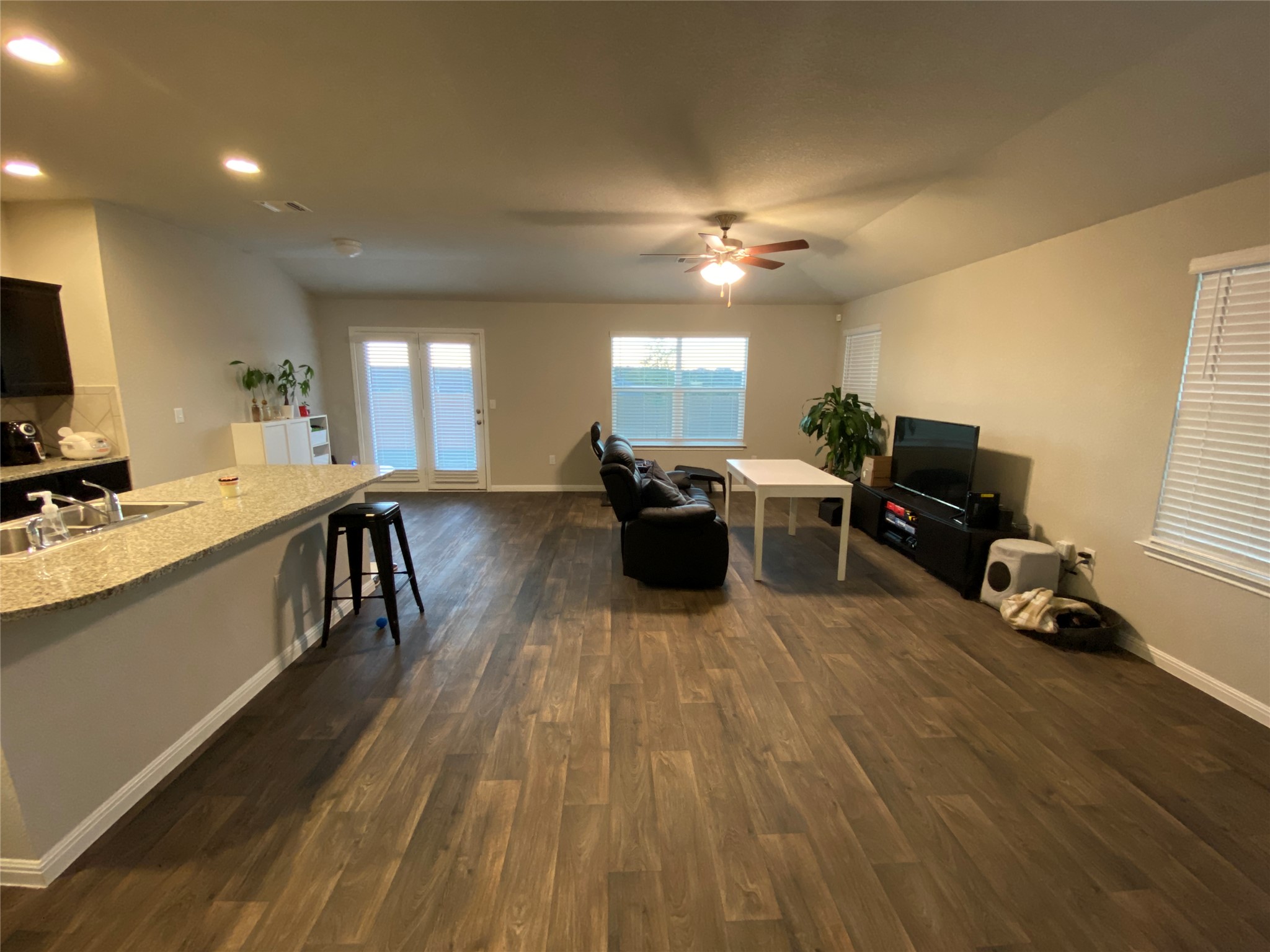 10916 Defender Trail Austin, TX 78754 - Photo 3 of 12 Living room featuring dark wood-style floors, a ceiling fan, and recessed lighting