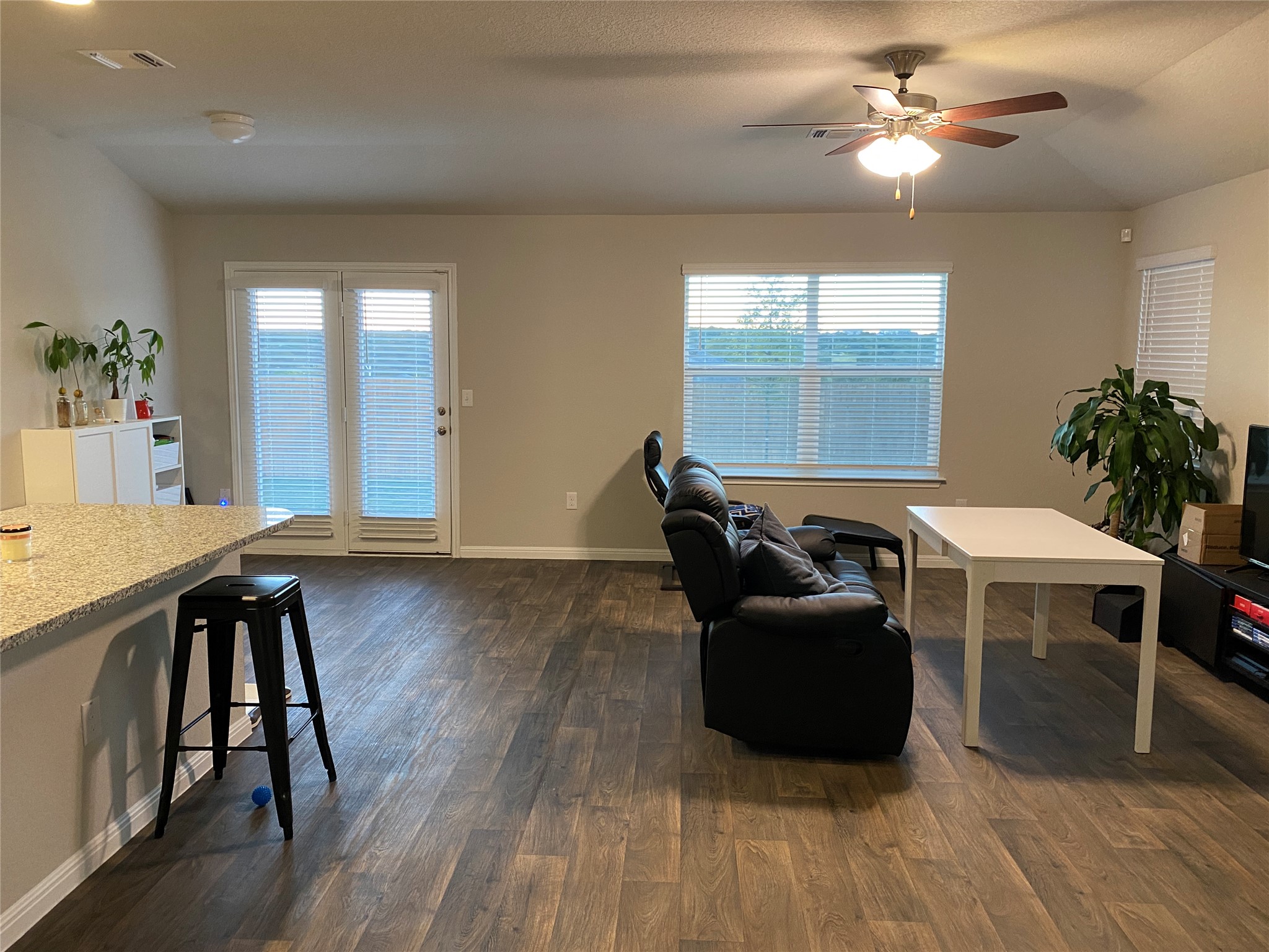 10916 Defender Trail Austin, TX 78754 - Photo 4 of 12 Living room featuring dark wood finished floors and a ceiling fan