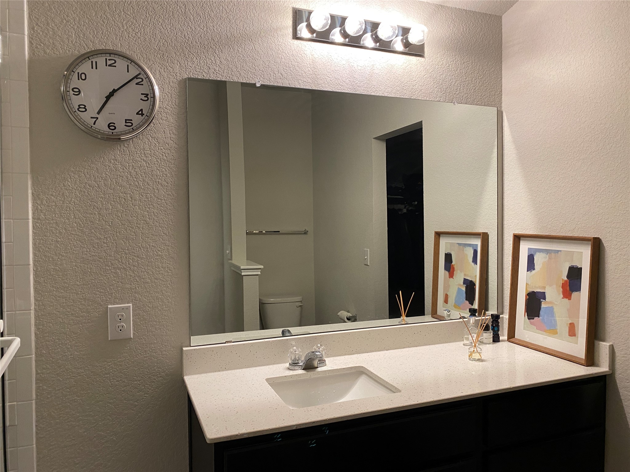 10916 Defender Trail Austin, TX 78754 - Photo 9 of 12 Bathroom with a textured wall and vanity
